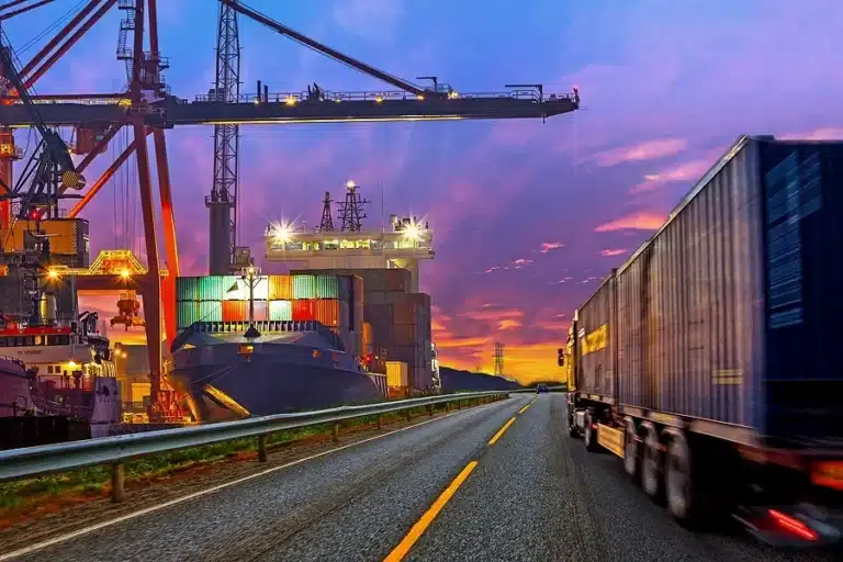 Container ship and truck at a shipping port - maritime fabrication in Michigan