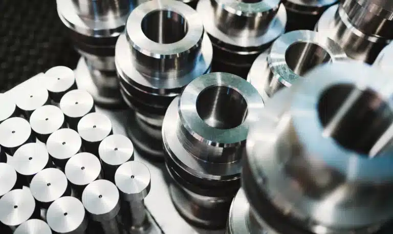 Rows of precision machined steel and aluminum production parts in Michigan